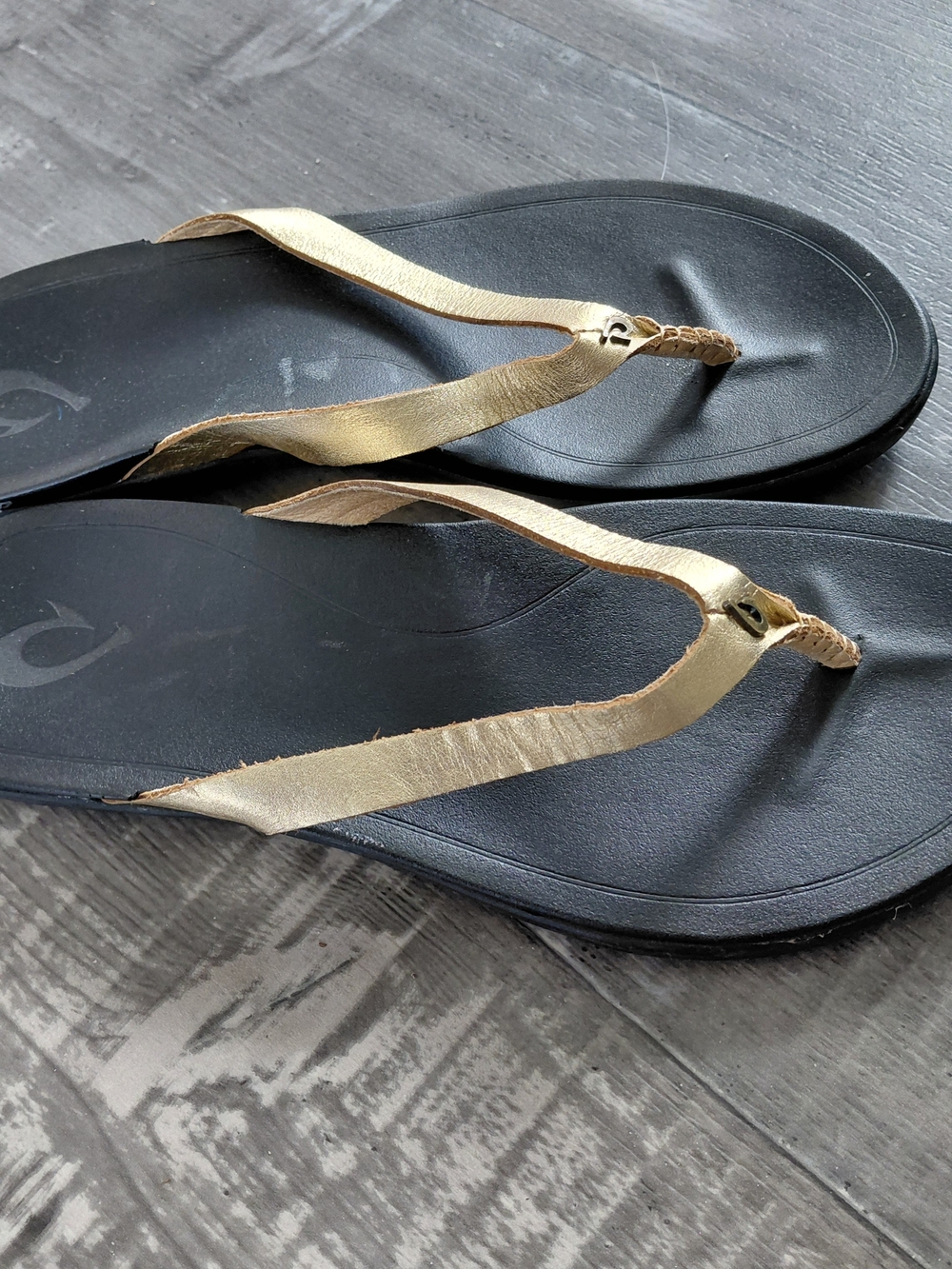 OluKai Black Footbed Sandals with Gold Straps - Women
